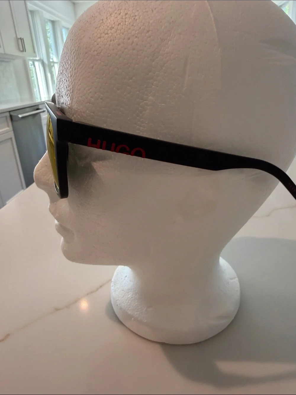 HUGO Men’s Black Sunglasses (recycled nylon) with Red-Orange Mirrored Lenses.